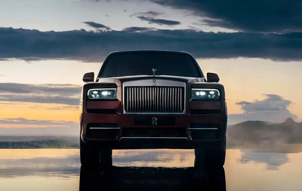 Rolls-Royce Cullinan front view at dusk, chauffeur-driven by Starr Luxury Cars